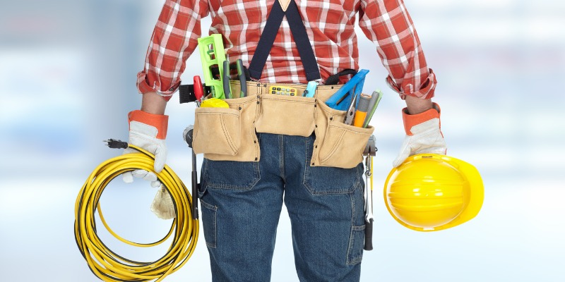 furance repairman holding tools
